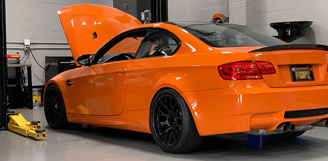 Orange BMW M3 Car In Our Garage For Repair