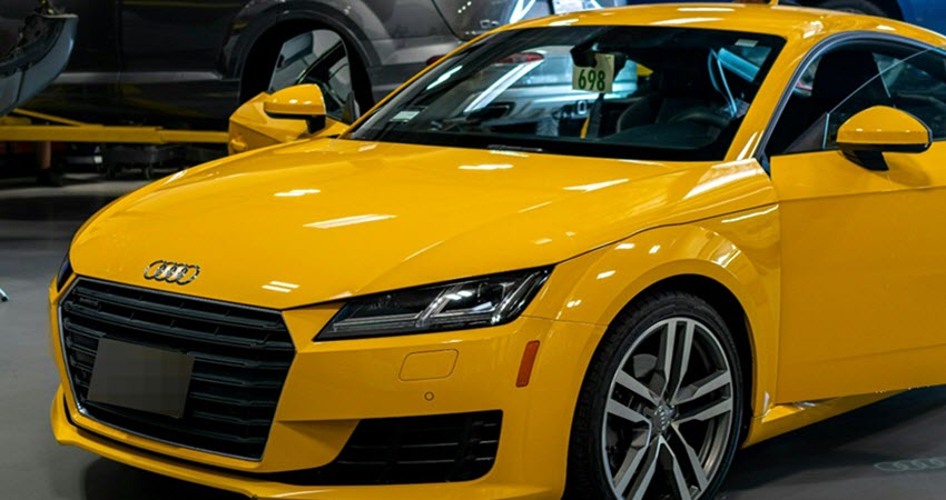 Yellow Audi Car In Our Garage For Repair
